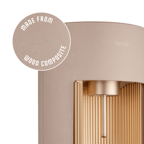 Glassy latte sparkling water maker with a close-up bubble showing the subtly visible wood fibres on the device's surface